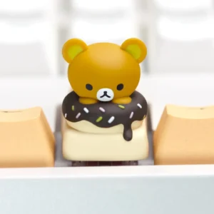 Adorable Rilakkuma Donut artisan keycap for mechanical keyboards, showcasing vibrant handcrafted details from various angles.
