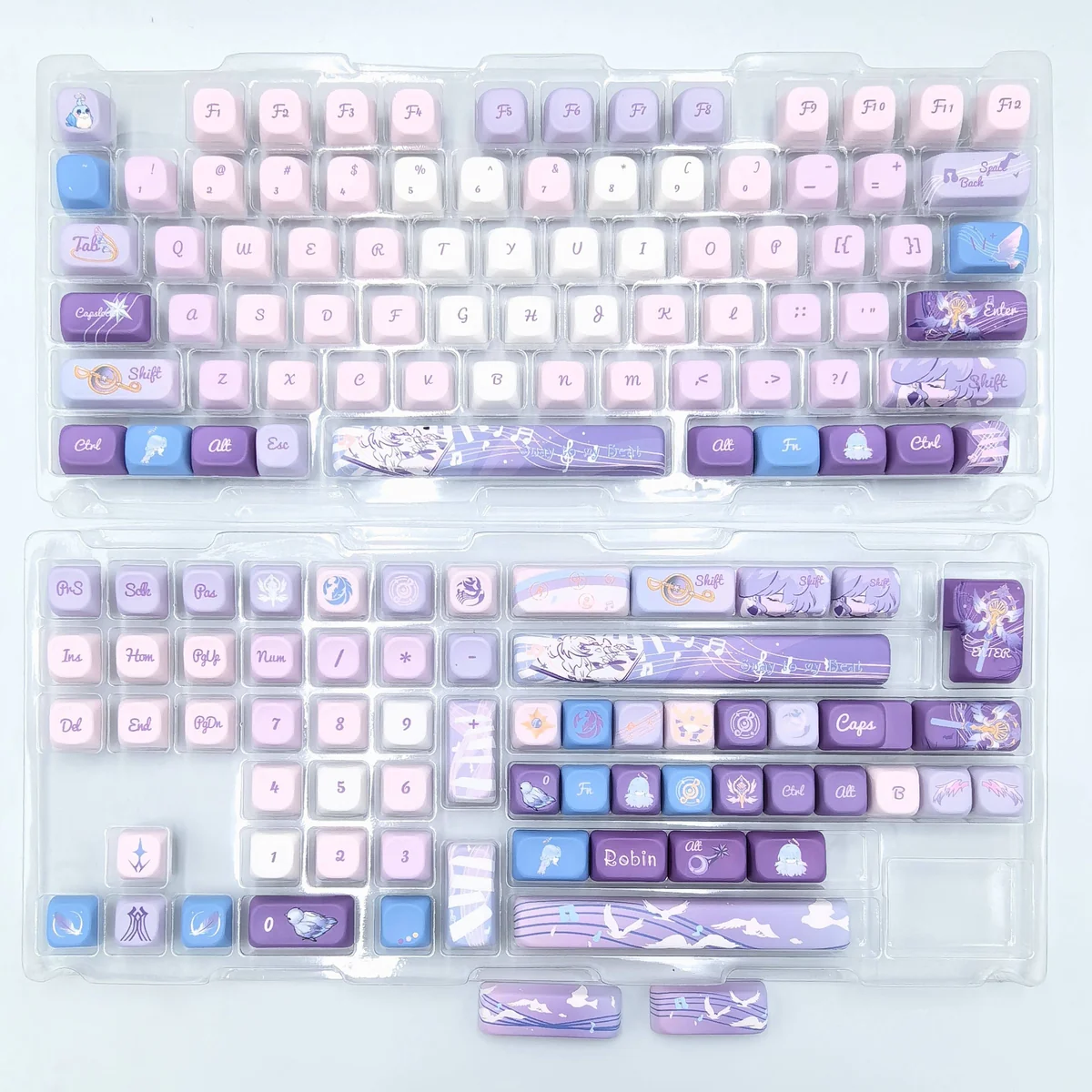 A detailed view of the distinctive Robin FOA Keycap Set, highlighting its calm pastel blue aesthetic and intricate bird-inspired art design.