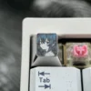 Gallery views of the Roxy Titanium Keycap, highlighting its precision-carved anime art, polished titanium finish, and intricate details from various angles.