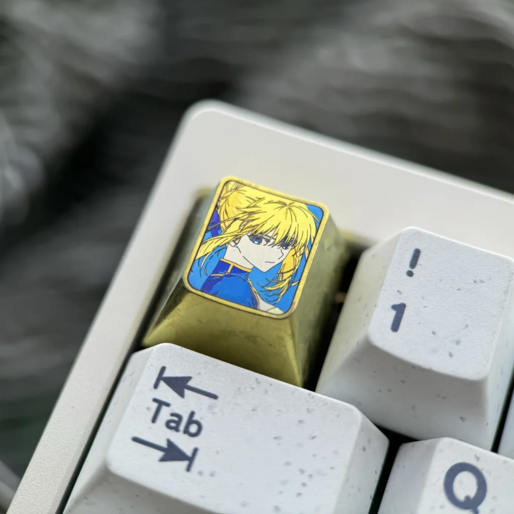 Vibrant Saber titanium alloy keycap, an artisan anime metal keycap for mechanical keyboards, showcasing its premium anodized finish and iconic hero design.