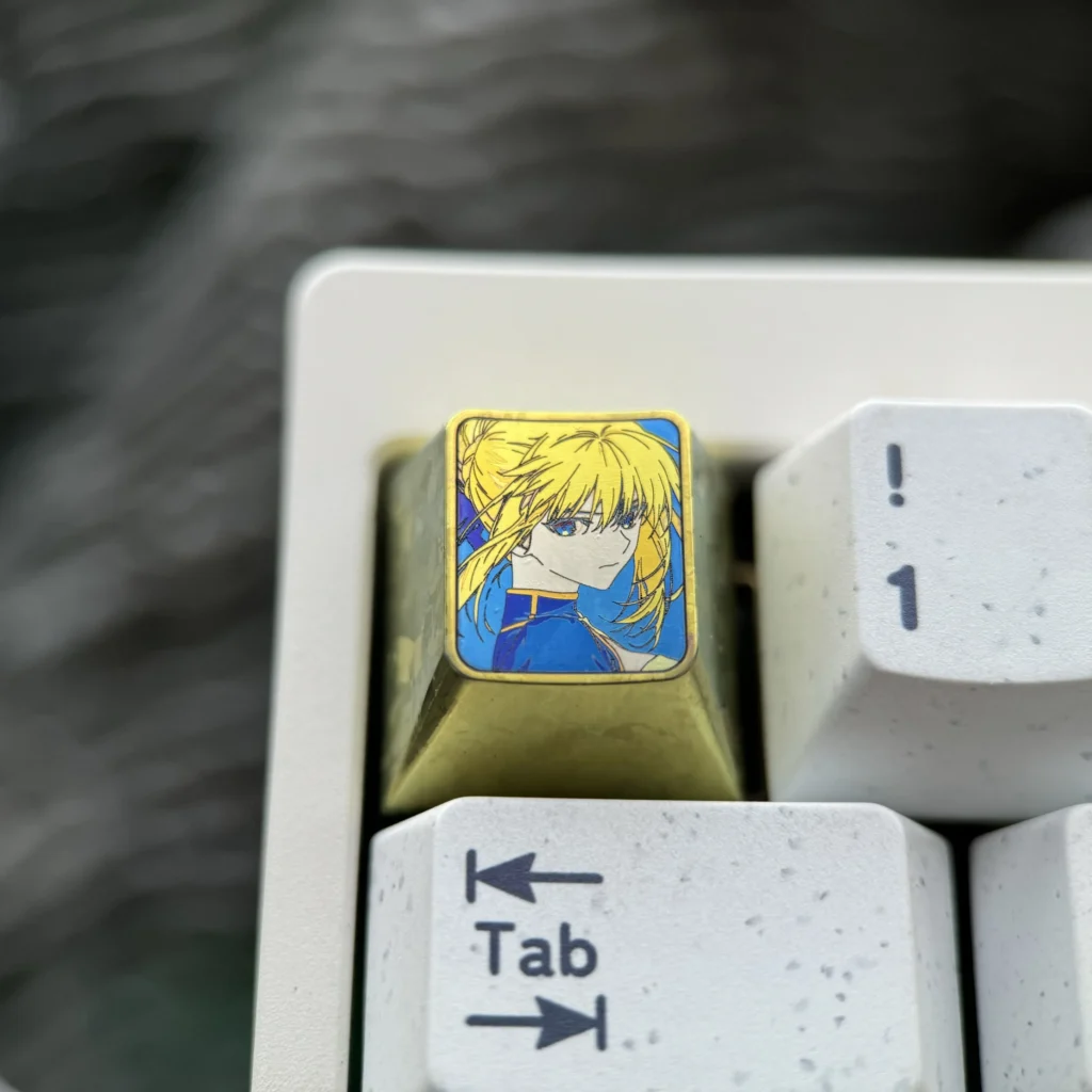 Vibrant Saber titanium alloy keycap for mechanical keyboards, showcasing artisan anime design with a premium anodized finish.