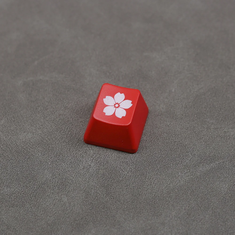 Multiple views of the Glowing Sakura ESC keycap, revealing its elegant cherry blossom design, premium backlit ABS, and tranquil RGB illumination.