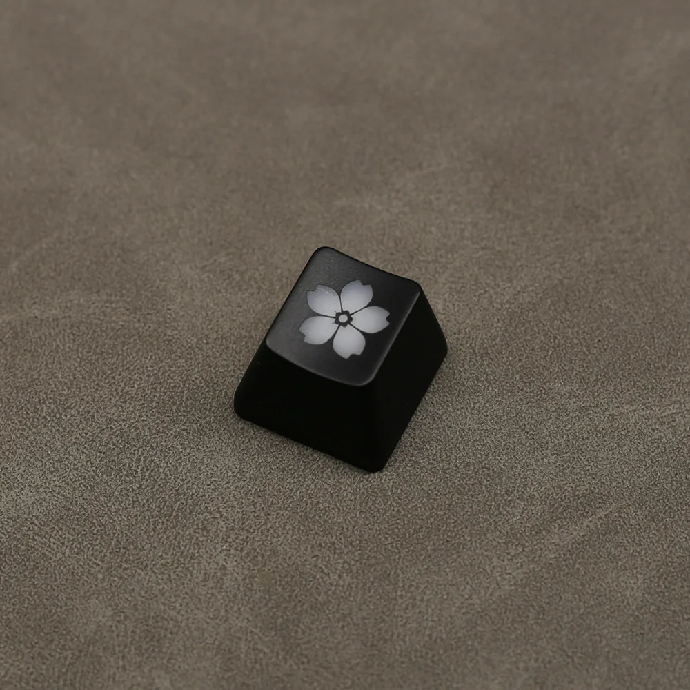Close-up of the elegant Glowing Sakura ESC keycap, showcasing its delicate backlit cherry blossom design and premium ABS finish from a side angle.