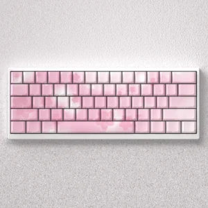 Exquisite Sakura Keycaps PBT set, side-lit with delicate pink and white cherry blossoms for mechanical keyboards.
