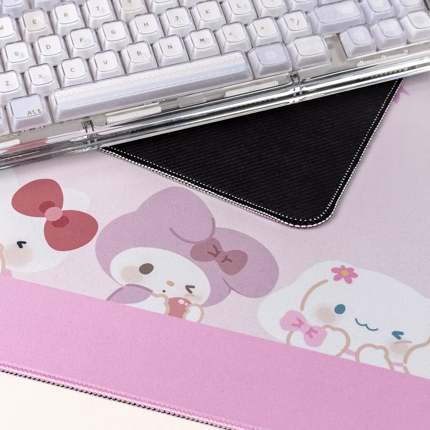 Vibrant Sanrio mouse pad shown from playful angles, highlighting adorable characters and the smooth surface engineered for joyful gaming.