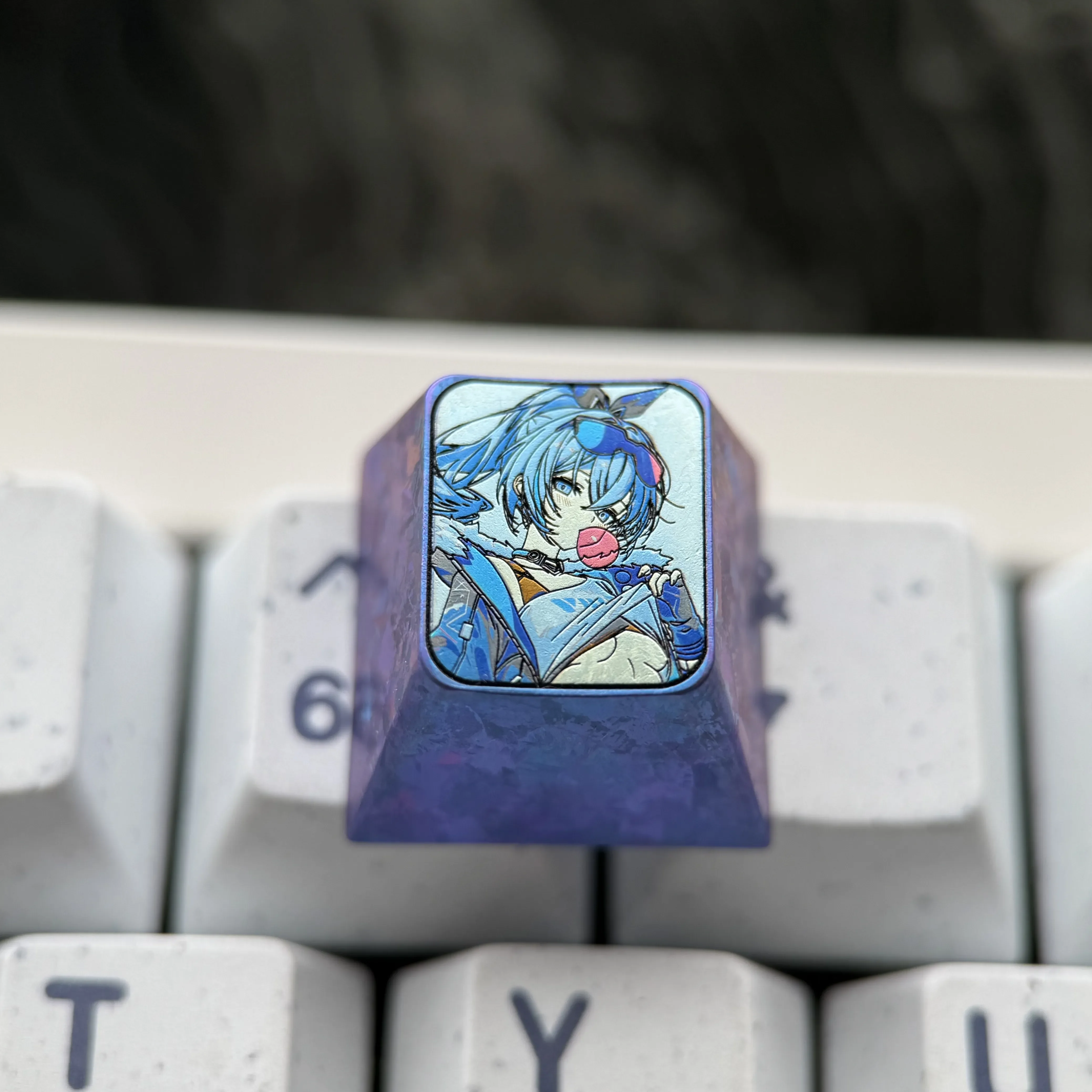 Detailed views of the premium Titanium Silver Wolf Keycap. Captures its cyber-hacker design and metallic finish, an artistic gaming accessory.