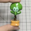Whimsical Squidward potted plant artisan keycap, meticulously handcrafted in resin, presented from a delightful, unique perspective.