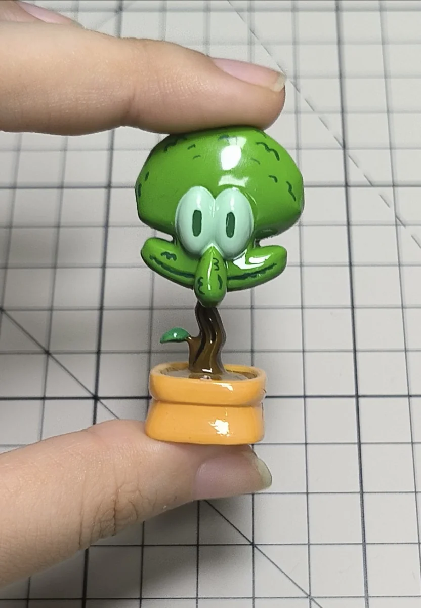 Whimsical Squidward potted plant artisan keycap, meticulously handcrafted in resin, presented from a delightful, unique perspective.