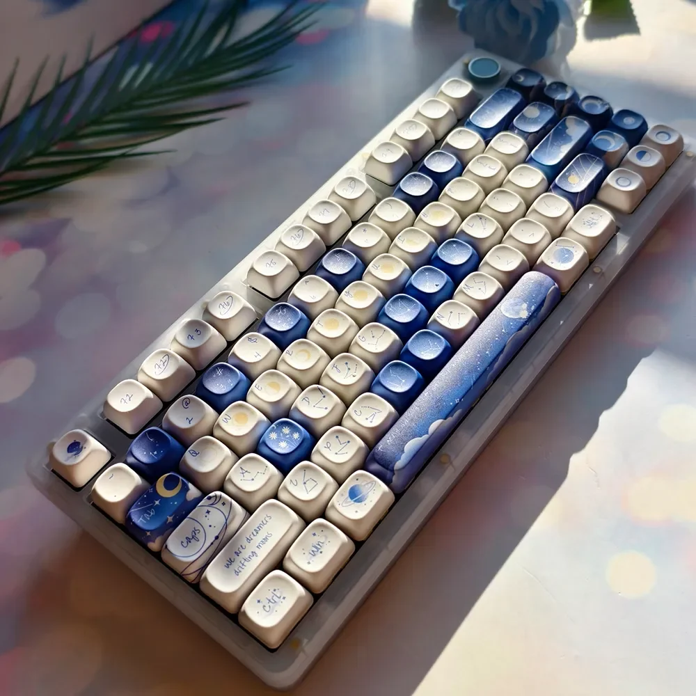 Starry Luminous PBT Keycaps: gallery views of glowing constellations, soft rounded profiles. Durable PBT for an artistic cosmic journey.