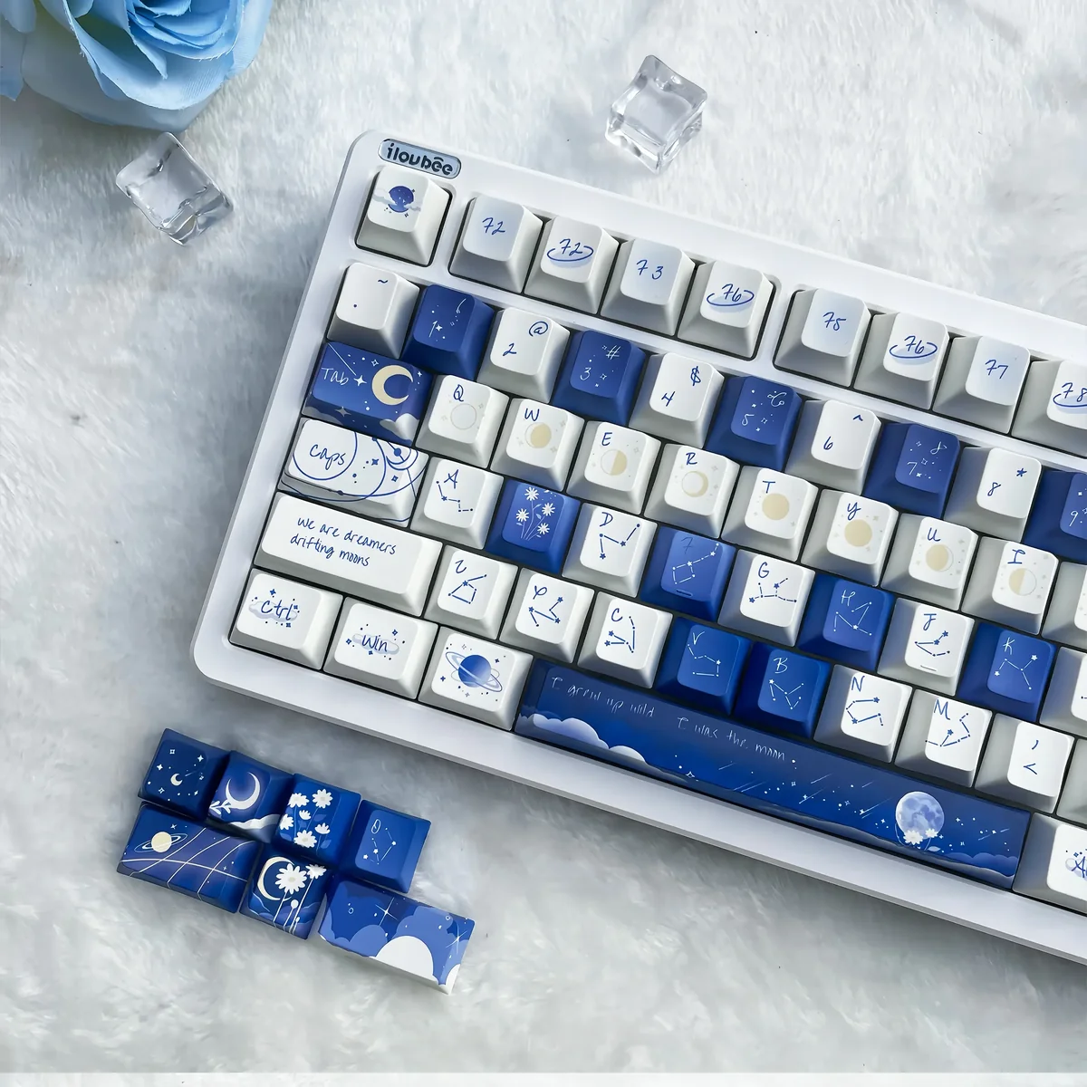 Starry Luminous PBT Keycap Set gallery showcasing glowing cosmic constellations, durable PBT, and soft rounded profiles from various artistic angles.