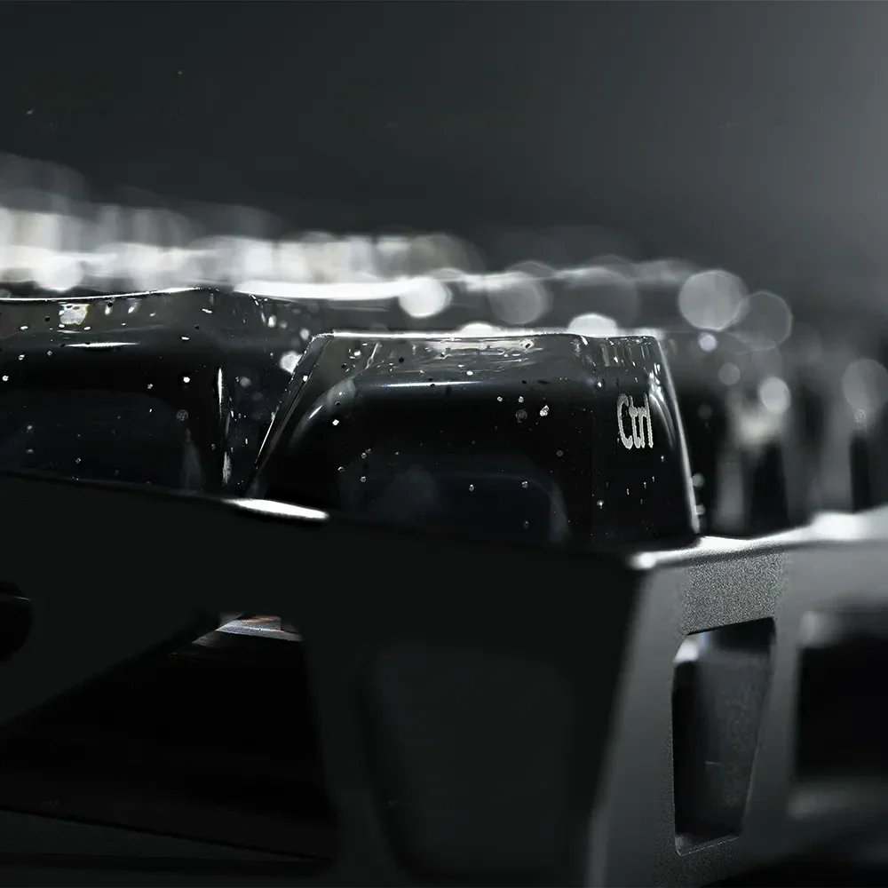 Collection of Celestial Glitter Starry Sky Keycaps Set, highlighting deep black translucent PC, sparkling embedded cosmic glitter, and precise design.