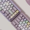Taro Pistachio PBT keycaps set in a sweet pastel blend of purple, green, and cream, viewed from multiple angles, highlighting their whimsical dessert-inspired.