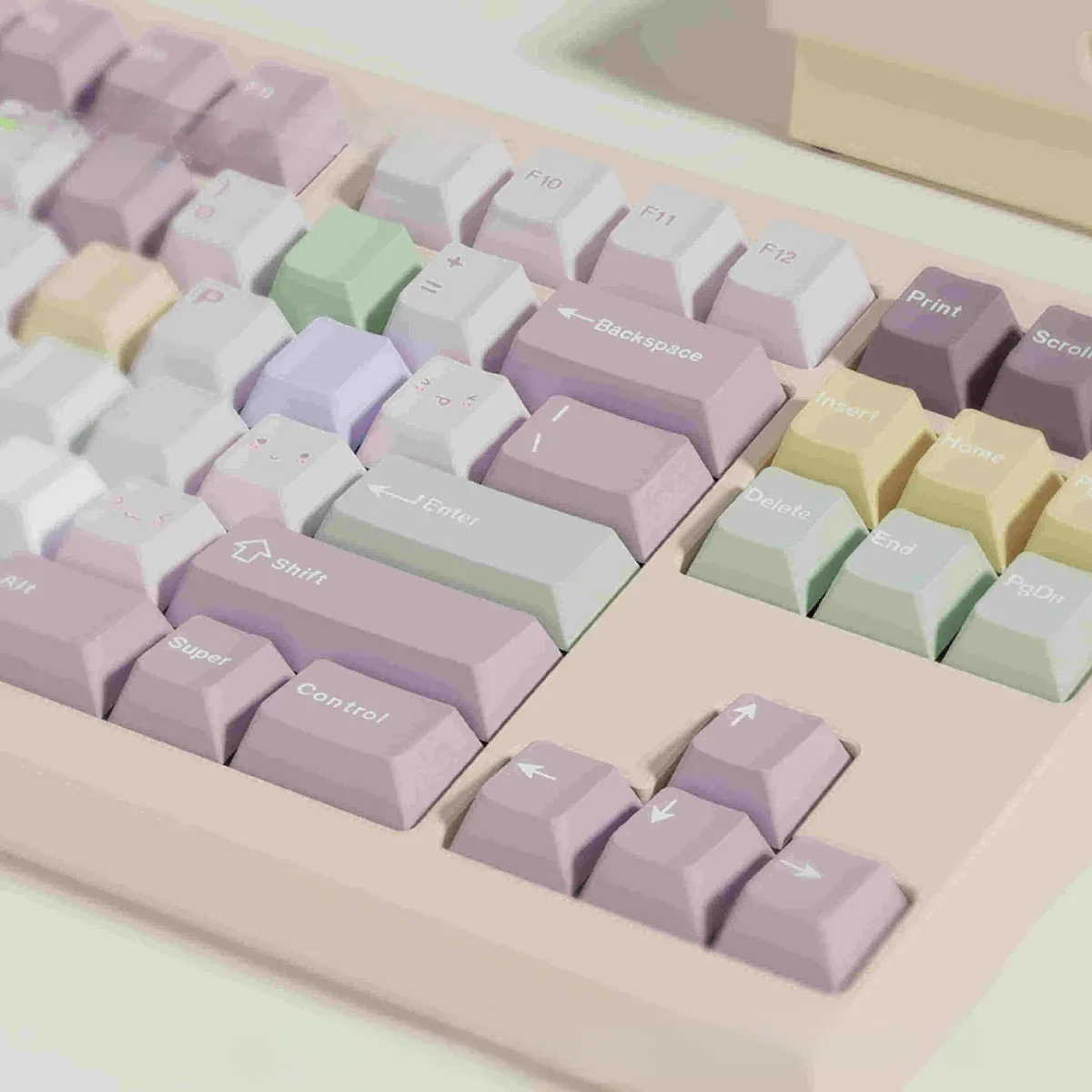 A whimsical gallery of Taro Pistachio Keycaps Set showcasing their sweet pastel purple, green, and cream dessert-inspired aesthetic from various angles.