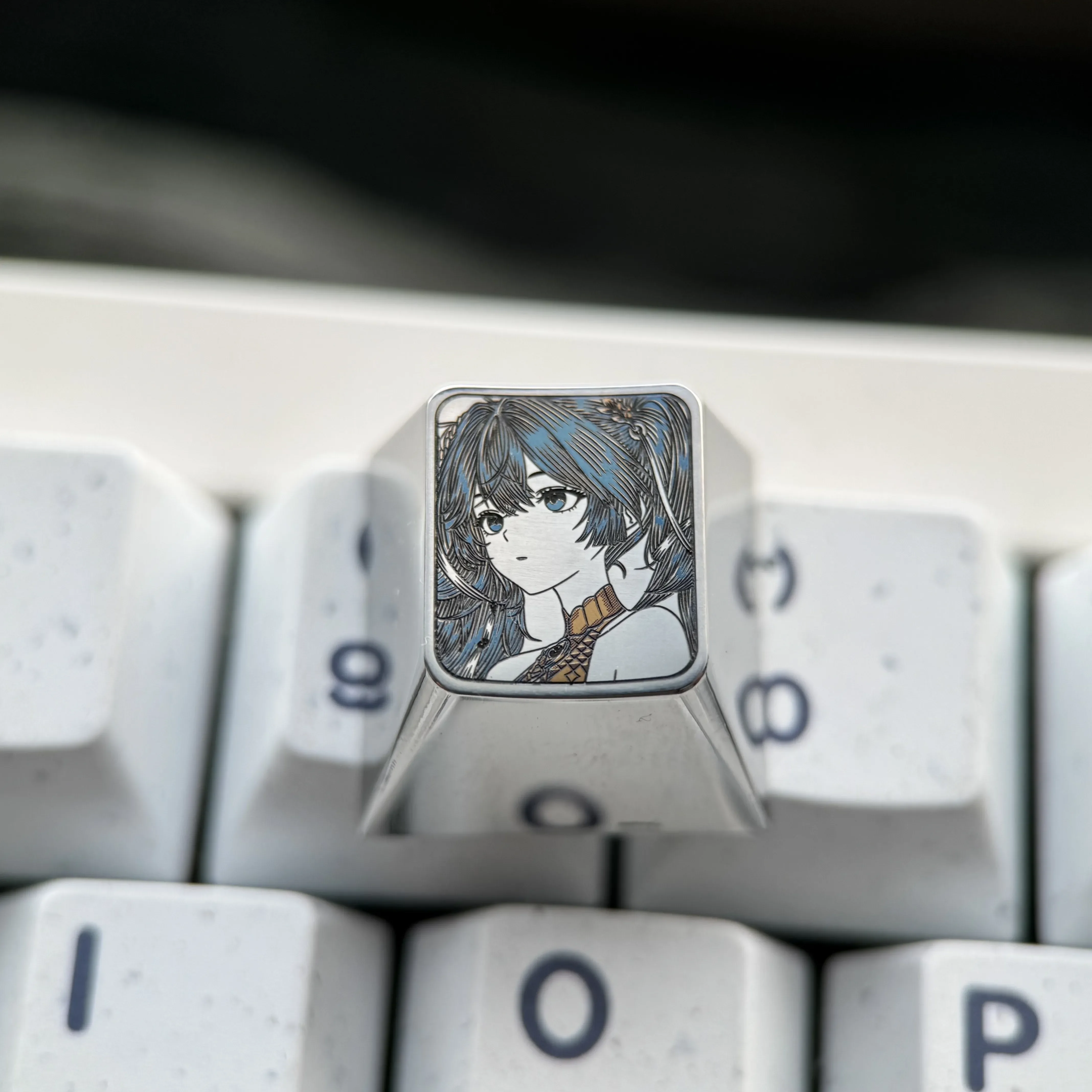 Precision-engraved Wuthering Waves: Iuno Keycap. A premium artisan titanium anime keycap with vibrant, intricate detail.