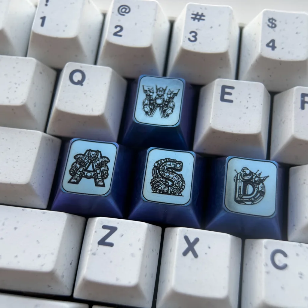 Titanium Gundam WASD gaming keycaps showcasing a futuristic design with vibrant anodized finishes for a premium setup.