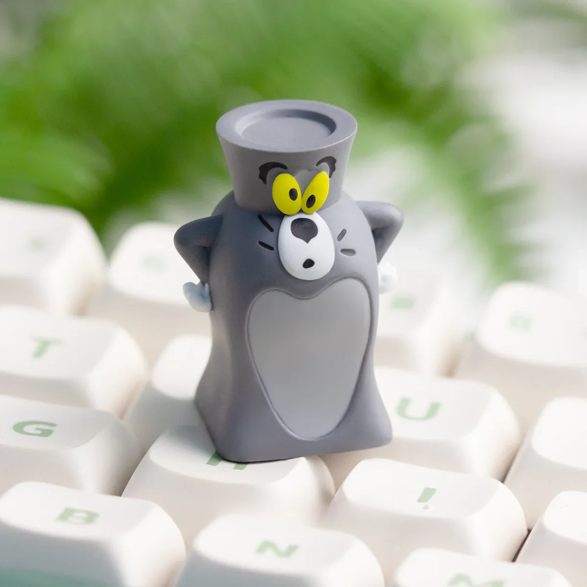 A playful, handcrafted Tom Jerry resin artisan keycap from a unique angle, highlighting its whimsical 3D art and nostalgic charm.