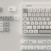 Tyche-One minimalist PBT keycaps set gallery, revealing their durable PBT material and crisp dye-sub legends from various angles.
