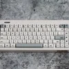 Tyche-One Minimalist PBT Keycaps Set displayed, highlighting their clean aesthetic and crisp dye-sub legends. Durable PBT ensures premium quality.