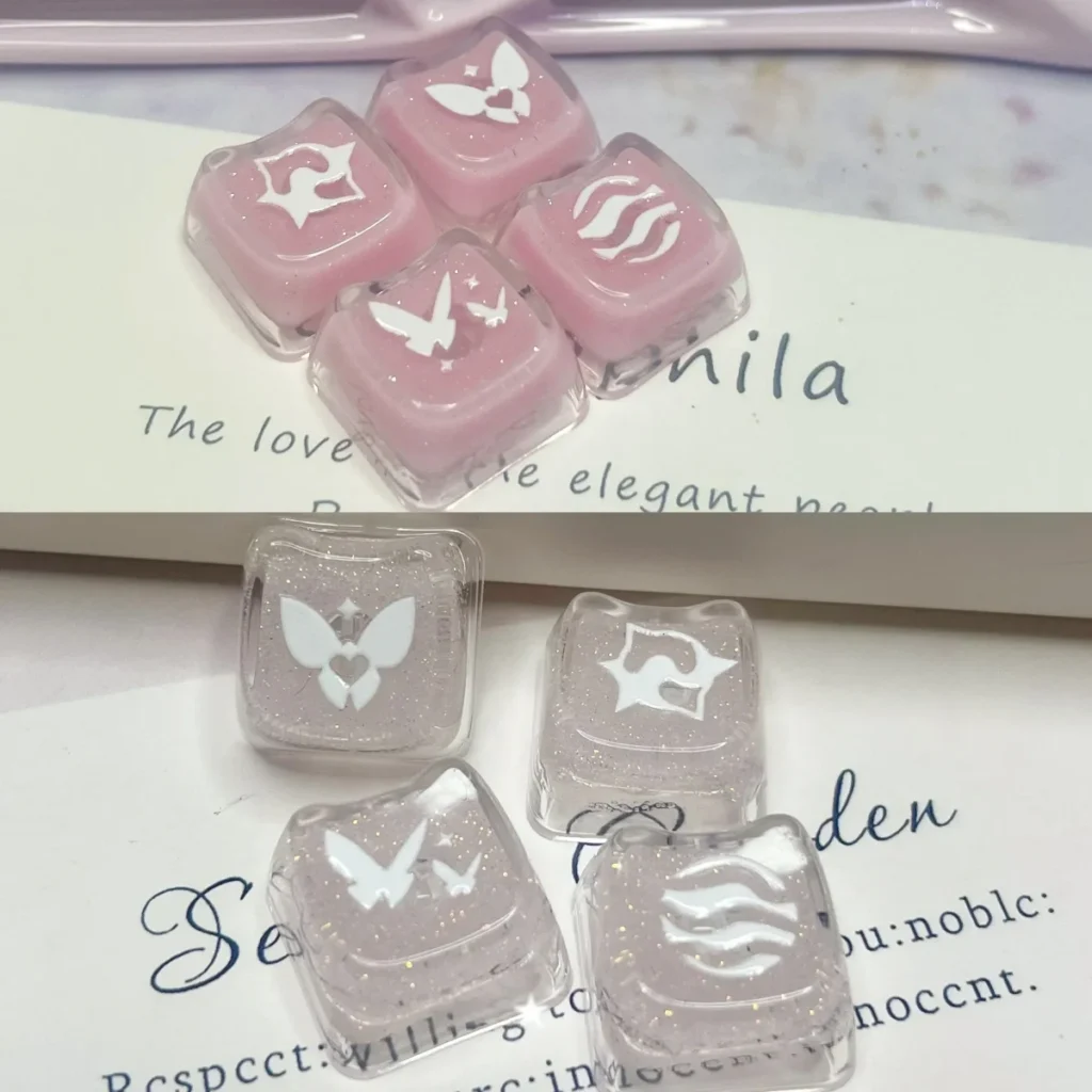 Enchanting pink translucent Valorant Keycaps with shimmering glitter, showcasing skill keys for mechanical keyboards.