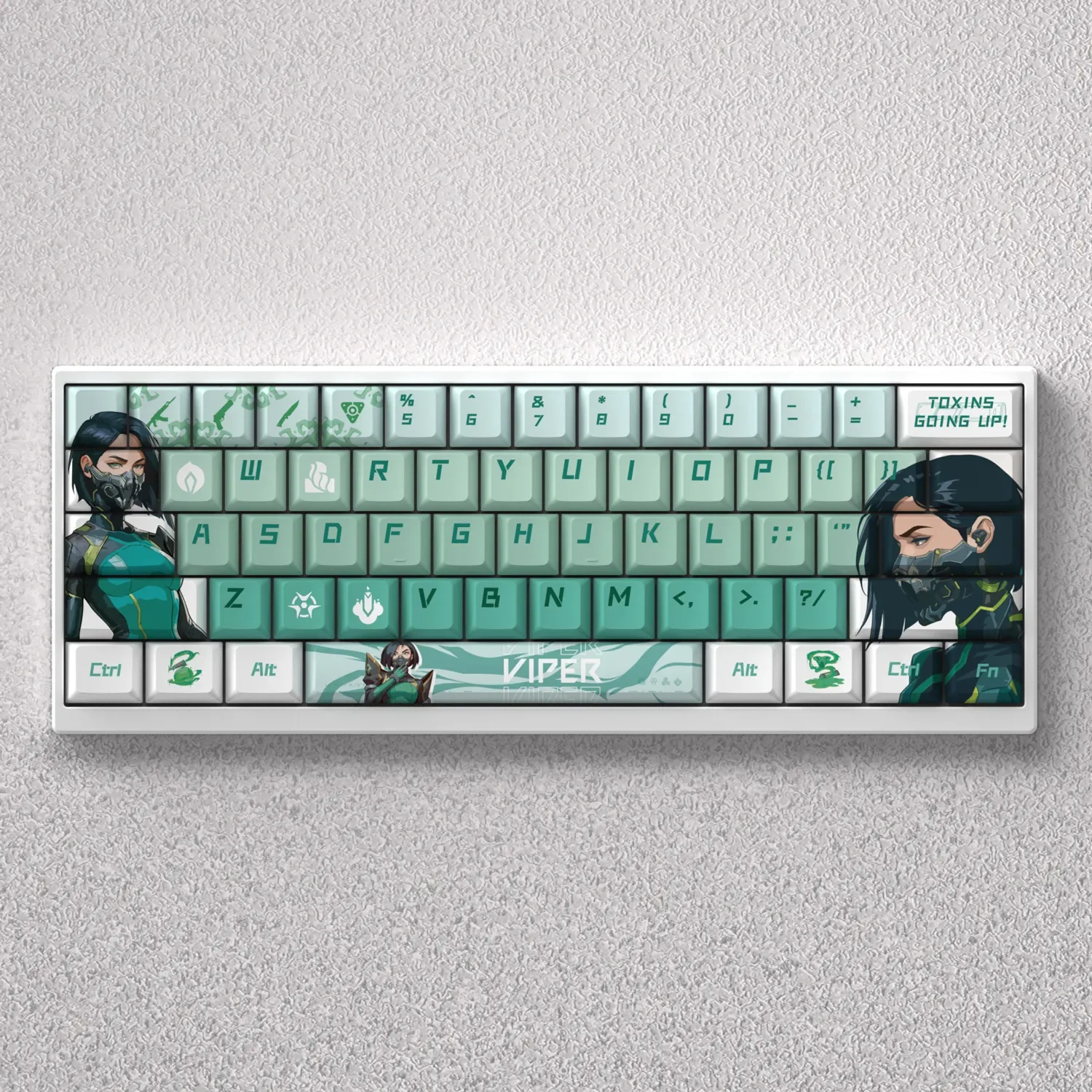 Multiple angles of Valorant Viper PBT dye-sub keycaps set, displaying tactical green edges and a sleek snake motif for gaming mechanical keyboards.