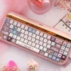Artistic display of Velvet Frosted Strawberry Keycap Set, showcasing their PBT+PC translucent glow and sweet frosted texture from various angles.