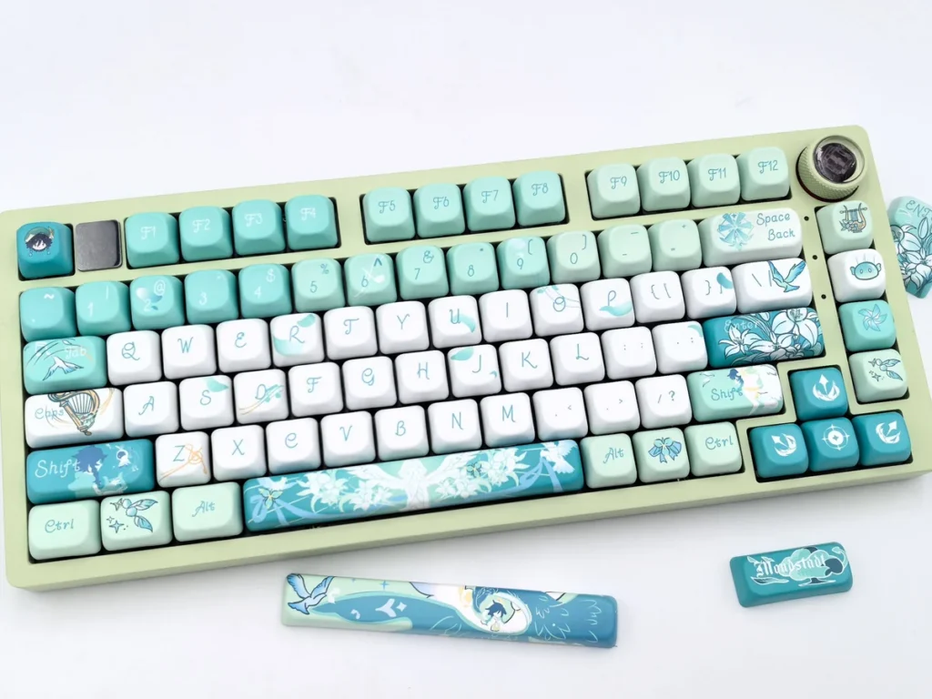 Exclusive Venti-inspired FOA PBT Dye-Sub Keycap Set. Whimsical Venti keycaps in ethereal teal, white, gold, with wind and lyre motifs.