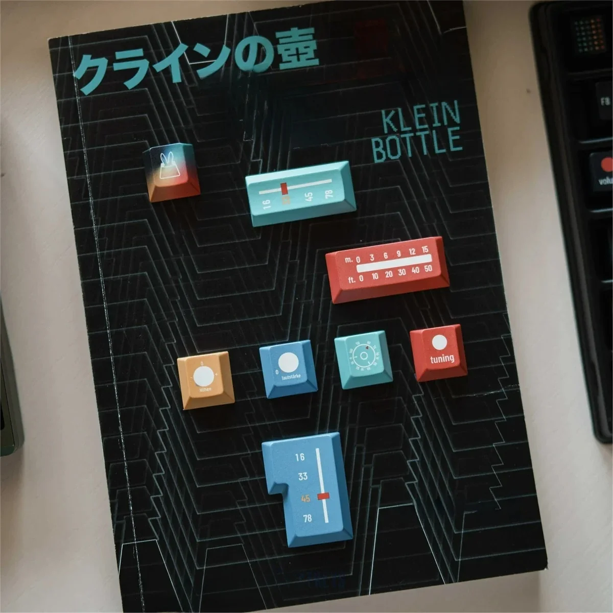 Ag1921 Braun-inspired PBT Wooting keycaps set, presented from an elegant side angle, highlighting their dark, minimalist industrial design and crisp legend design.