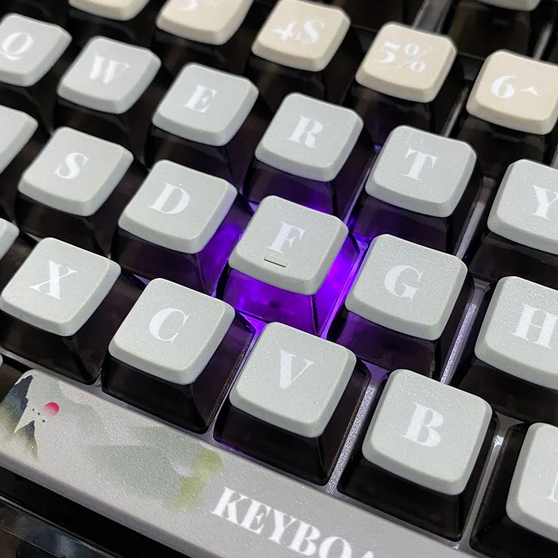 Exquisite Jiangnan Wuxia ink wash art PBT pudding keycaps set displayed from multiple angles, showcasing the traditional Chinese landscape and martial art.