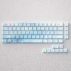 Ethereal Yuki-onna Keycaps Set: A PBT set featuring mystical snow maiden art in icy blues, inspired by Japanese folklore.