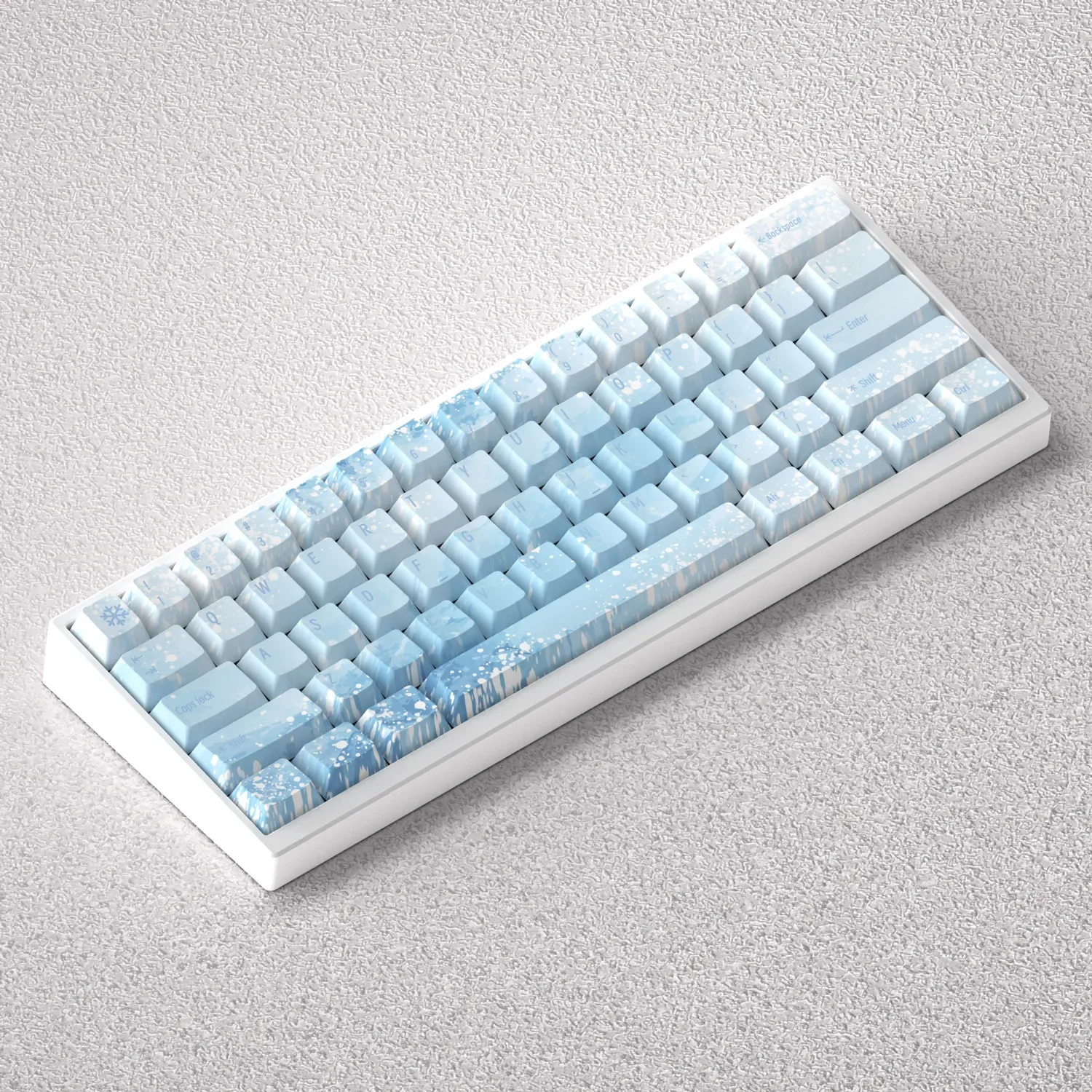 Ethereal Yuki-onna Keycaps PBT set displayed in a gallery, highlighting delicate graphics and icy blue hues inspired by Japanese folklore.