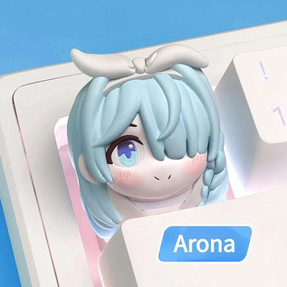 Close-up gallery of the iconic Blue Archive Arona keycap, highlighting its cute character, vibrant colors, and intricate sculptural details from various angles.