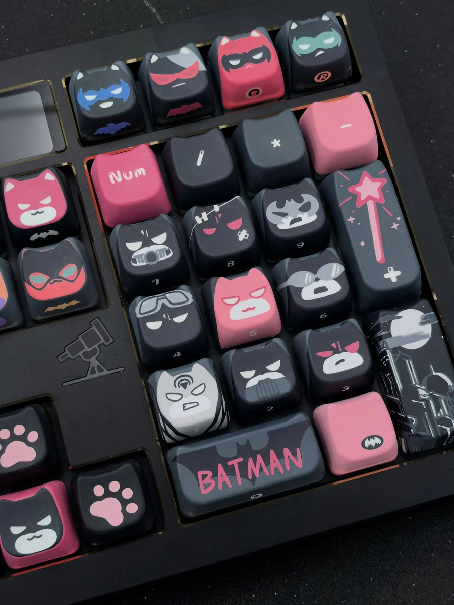 Multiple angles of the unique handcrafted Artisan Batman Keycap Set, showcasing its intricate sculpted details and playful design for collectors.