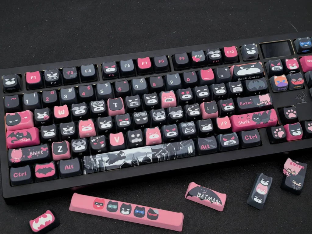 Close-up of a unique handcrafted artisan Batman Keycap Set, showcasing its iconic yet playful sculpted design perfect for collectors.