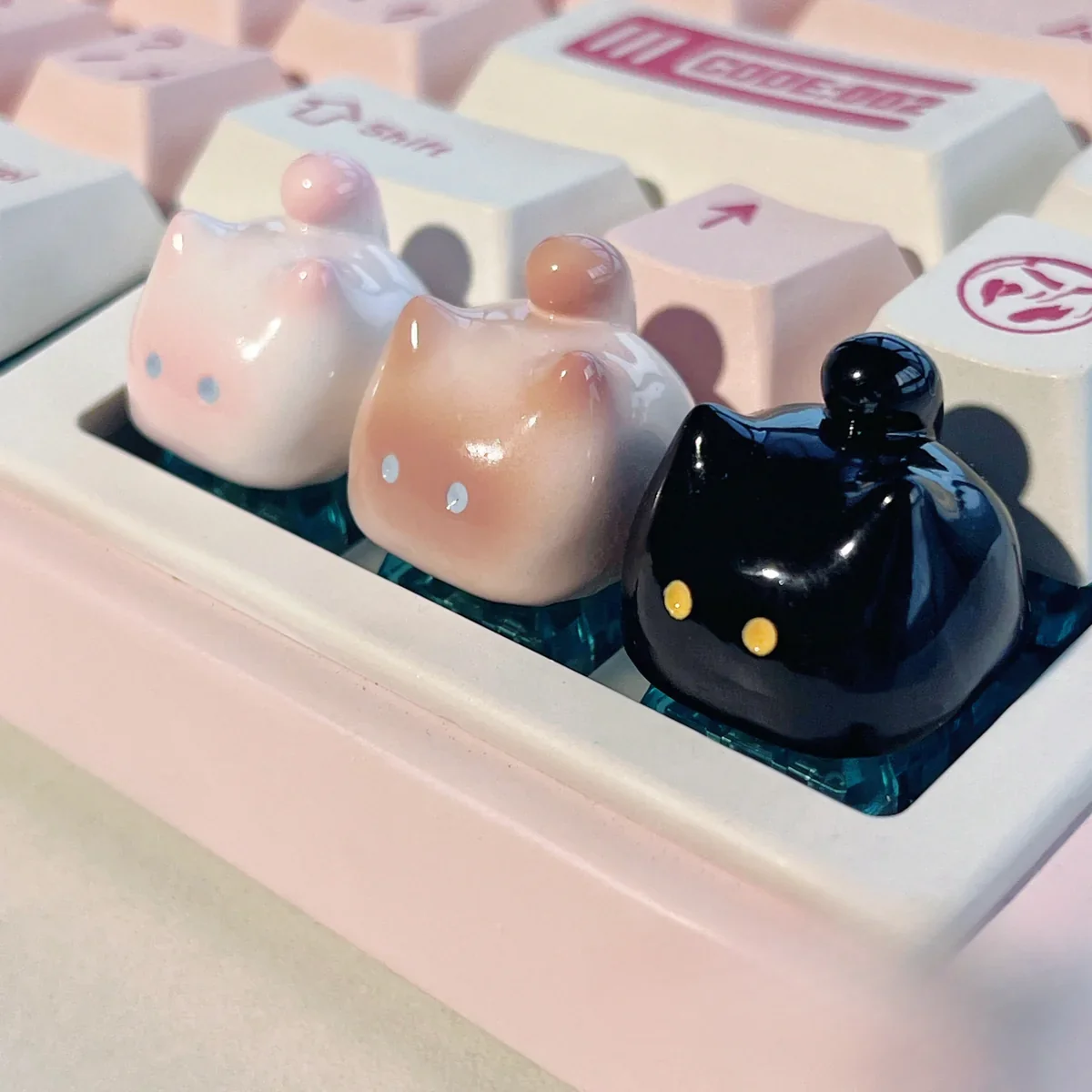 Gallery of whimsical handcrafted artisan cat keycaps from various angles, highlighting unique, adorable, and expressive designs that elevate desk aesthetics.