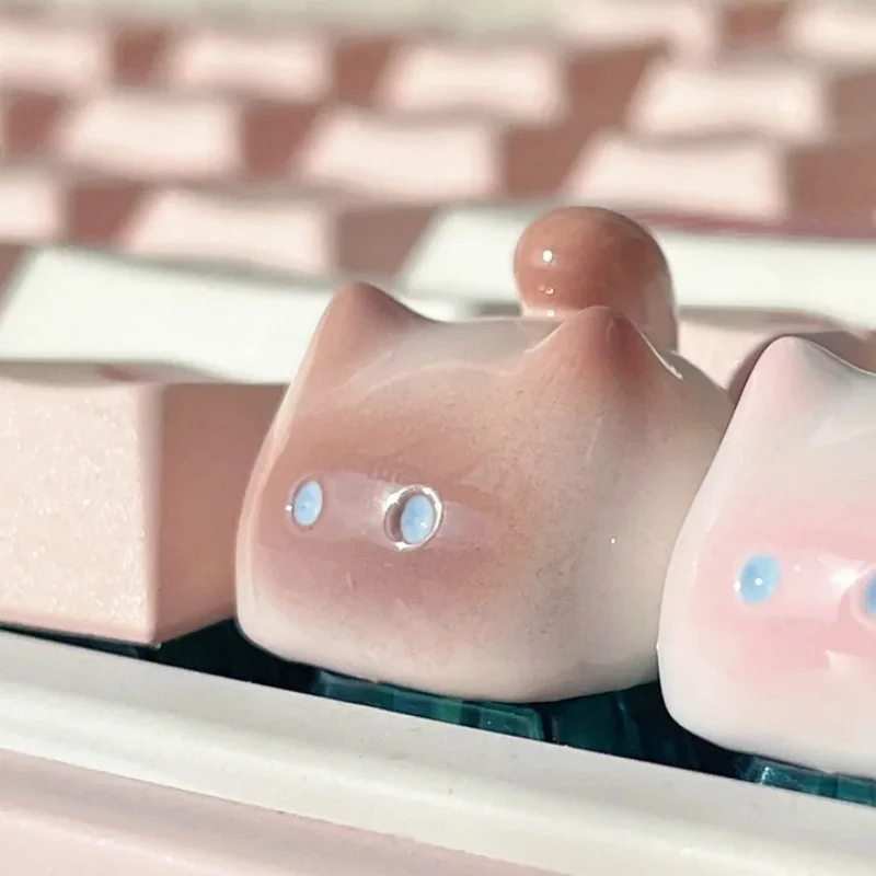 Whimsical handcrafted artisan cat keycap gallery. Unique, adorable feline designs in varied colors, multiple angles, highlighting premium craftsmanship.