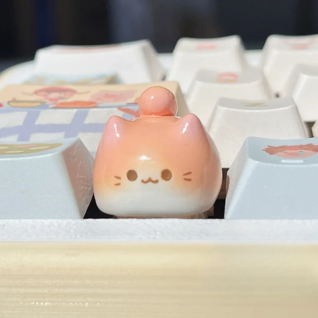 Whimsical handcrafted artisan cat keycaps gallery. Unique, adorable cat designs in varied colors and styles, shown from multiple angles.