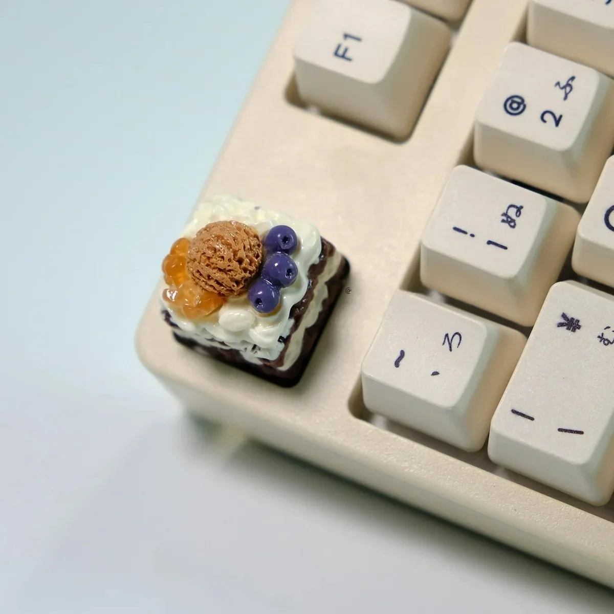 Detailed gallery of playful handcrafted artisan dessert keycaps, displaying vibrant, realistic miniature ice cream and cake designs from various angle.