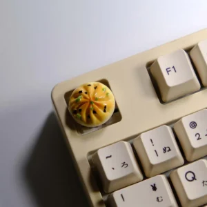 Handmade Pan-Fried Bun Keycap. Realistic, golden-brown miniature pan-fried bun, meticulously detailed with playful handmade charm.