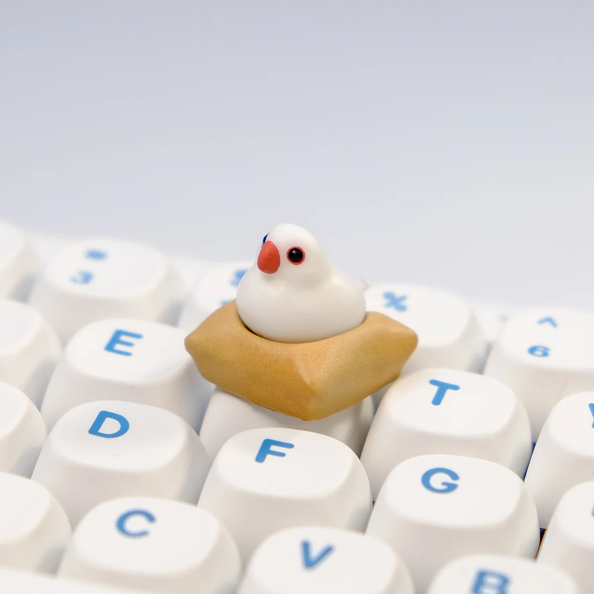 Another view of the exquisite handcrafted 3D artisan Java Sparrow keycap, revealing the intricate miniature bird scene and textured mat. Highlights its artistic design.