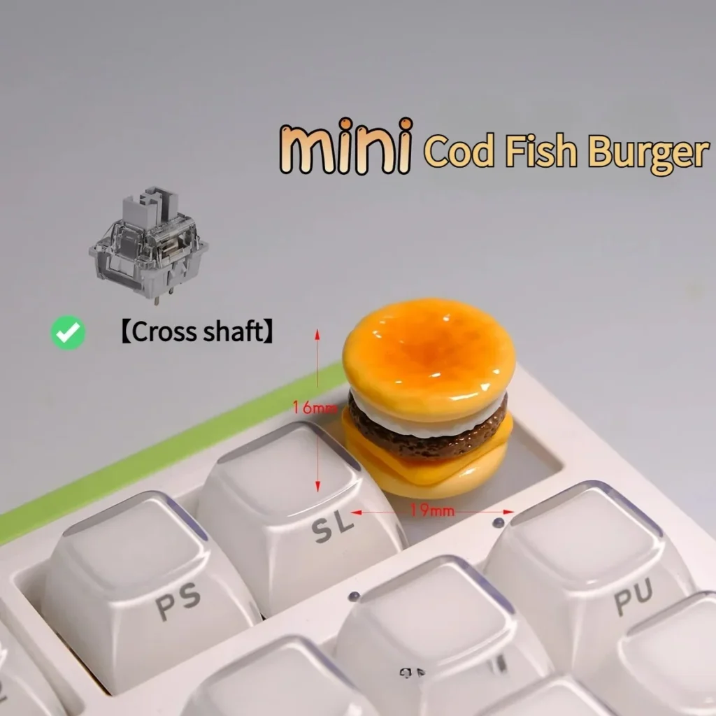 Handmade Mini Cod Fish Burger Keycap showcasing the hyper-realistic cheese cod burger from various angles, highlighting intricate textures and vibrant colors.