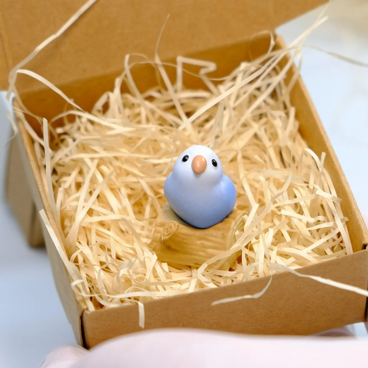 Vibrant hand-sculpted 3D artisan keycap showcasing multiple intricate angles of the parrot design.