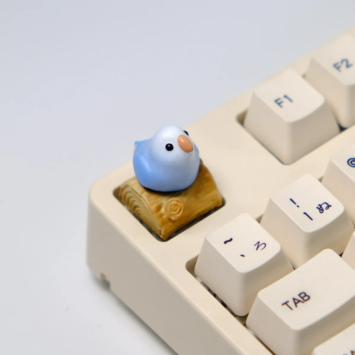 Detailed views of the vibrant hand-sculpted 3D artisan keycap, highlighting the intricate parrot nature scene from various angles.