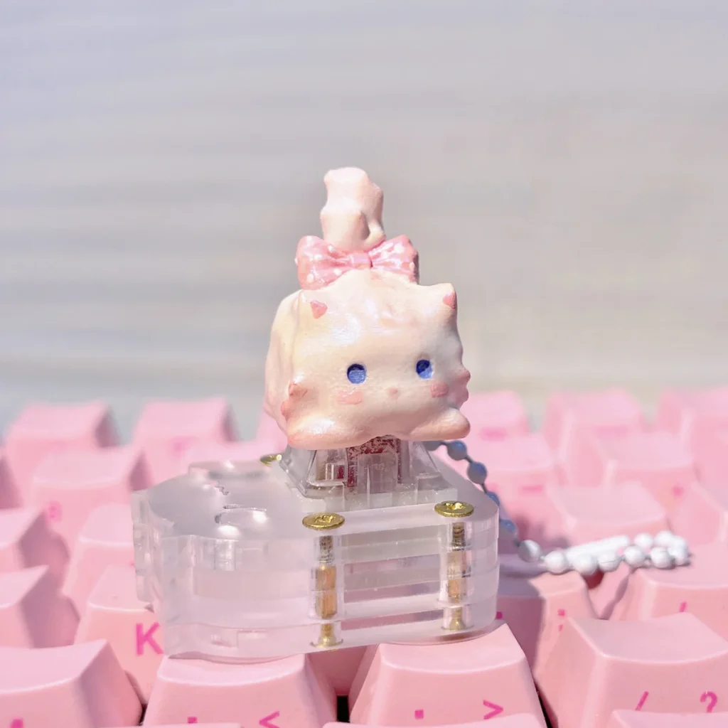 Whimsical fluffy cat artisan keycap, revealing its unique handcrafted details, warm white tones, and charm from various perspectives.