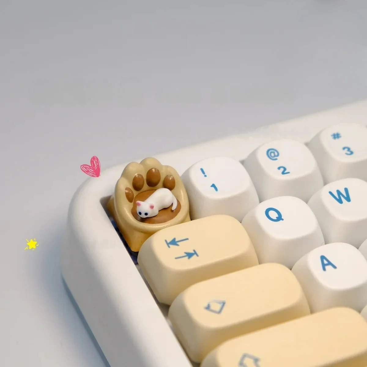 Close-up of a whimsical handcrafted magnetic Cat Paw Sofa Artisan Keycaps from a side angle, showcasing its intricate details and bright blue eyes design.