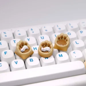 Whimsical handcrafted magnetic 3D Cat Paw Sofa Artisan Keycaps featuring a miniature white cat with blue eyes on a cozy custom sofa.