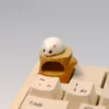 Handmade magnetic hamster artisan keycap, featuring the adorable, detachable hamster sitting cozily on its detailed woodland stump.