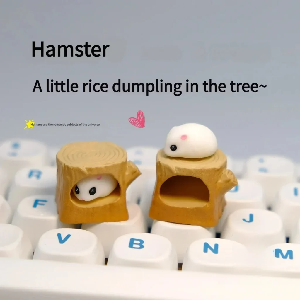 Handmade magnetic hamster stump artisan keycap showing the adorable, detachable hamster peeking from its cozy log on a mechanical keyboard.