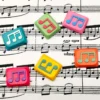 Vibrant handcrafted Musical Note Low Shaft Keycaps featuring fluid dual-tone music notes, artistically displayed from multiple angles to highlight exquisite design.