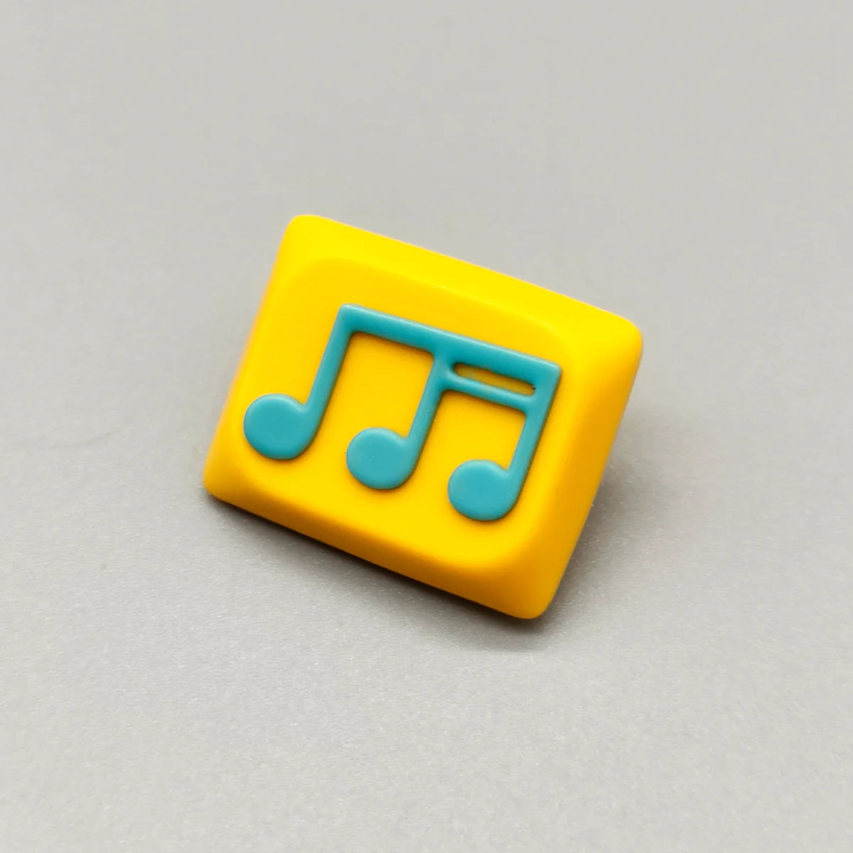 Vibrant yellow-green handcrafted Musical Note Low Shaft Keycaps with a fluid music note design, showcasing artistic and playful aesthetics.