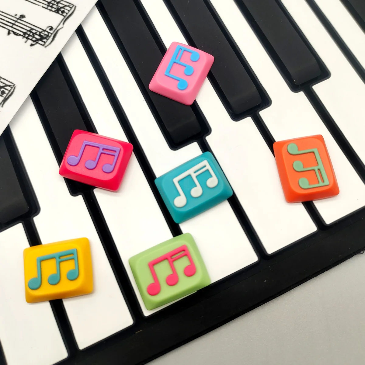 Musical Note Low Shaft Keycaps, handcrafted with dual-tone fluid design, showcasing artistic detail from multiple angles.